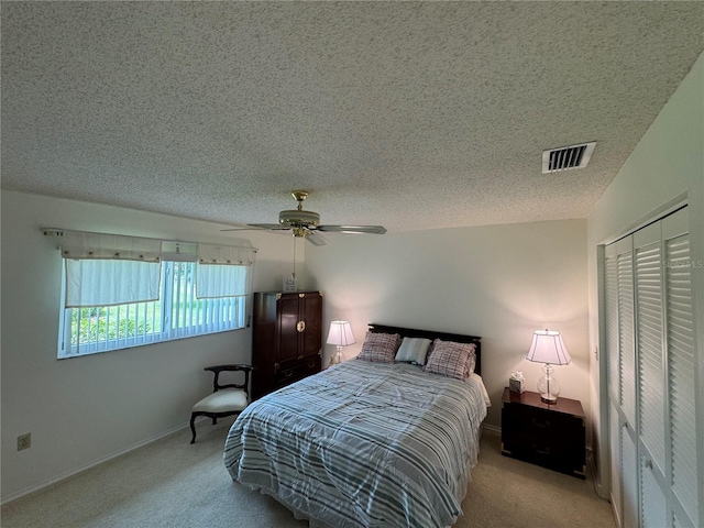 3752 Collins St Unit 508, Sarasota, FL 34232 - bedroom with carpet floors, a textured ceiling, a closet, ceiling fan, and baseboards