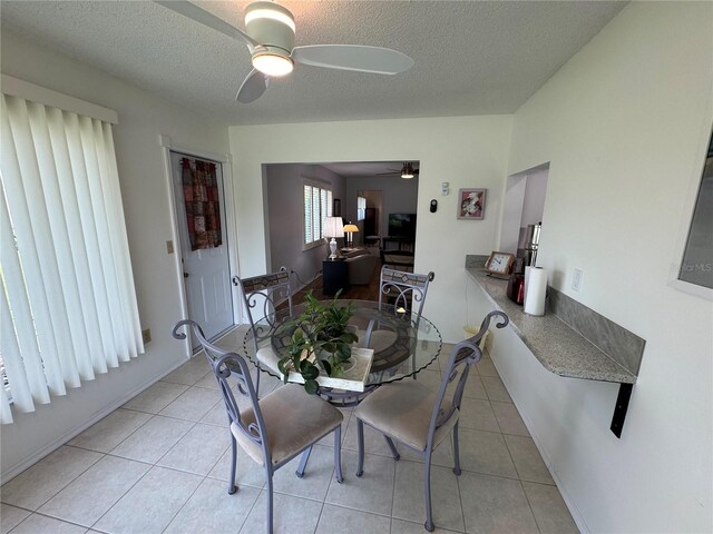 3752 Collins St Unit 508, Sarasota, FL 34232 - dining area with ceiling fan, a textured ceiling, and light tile patterned floors