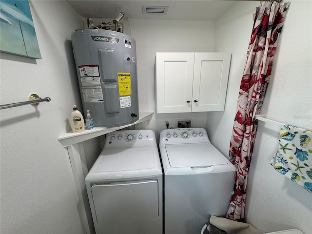 3752 Collins St Unit 508, Sarasota, FL 34232 - laundry area with electric water heater, independent washer and dryer, and cabinet space