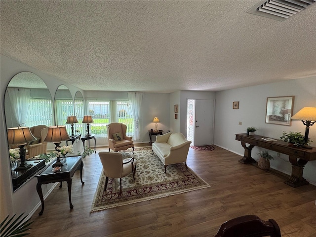 3752 Collins St Unit 508, Sarasota, FL 34232 - living area with a textured ceiling, wood finished floors, and baseboards