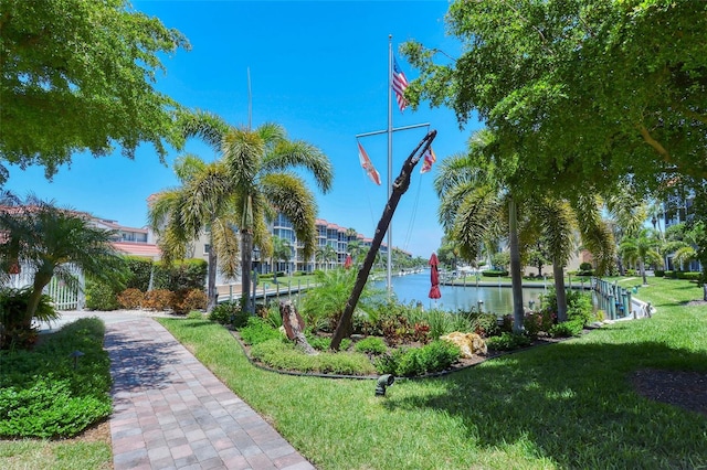 1350 N Portofino Dr Unit 402, Sarasota, FL 34242 - view of property's community featuring a lawn and a water view