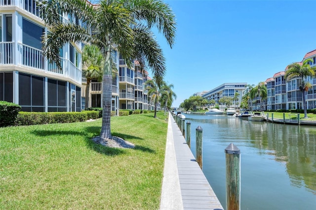 1350 N Portofino Dr Unit 402, Sarasota, FL 34242 - dock featuring a water view and a yard