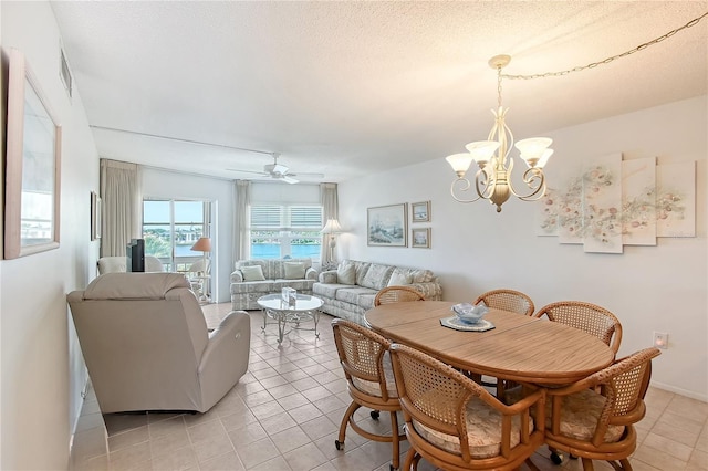 1350 N Portofino Dr Unit 402, Sarasota, FL 34242 - dining room with a chandelier, ceiling fan, and light tile patterned floors