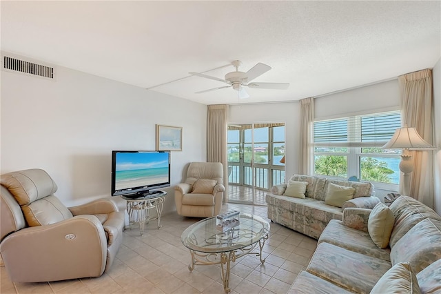 1350 N Portofino Dr Unit 402, Sarasota, FL 34242 - living area with a ceiling fan and light tile patterned floors