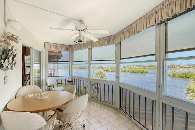 1350 N Portofino Dr Unit 402, Sarasota, FL 34242 - sunroom with a water view and ceiling fan