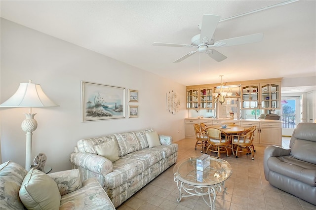 1350 N Portofino Dr Unit 402, Sarasota, FL 34242 - living area with ceiling fan and light tile patterned floors