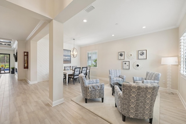 13606 Deep Blue Pl, Bradenton, FL 34211 - living area featuring crown molding, light wood-style floors, a chandelier, baseboards, and recessed lighting