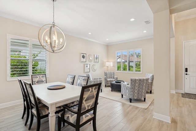 13606 Deep Blue Pl, Bradenton, FL 34211 - dining space with a chandelier, light wood-type flooring, crown molding, baseboards, and recessed lighting