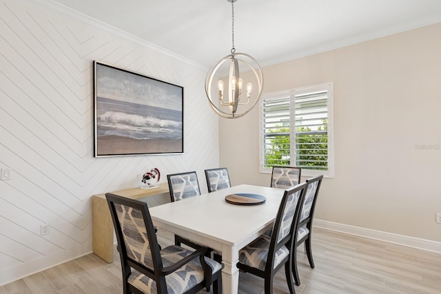 13606 Deep Blue Pl, Bradenton, FL 34211 - dining area with a chandelier, light wood-type flooring, baseboards, crown molding, and wooden walls