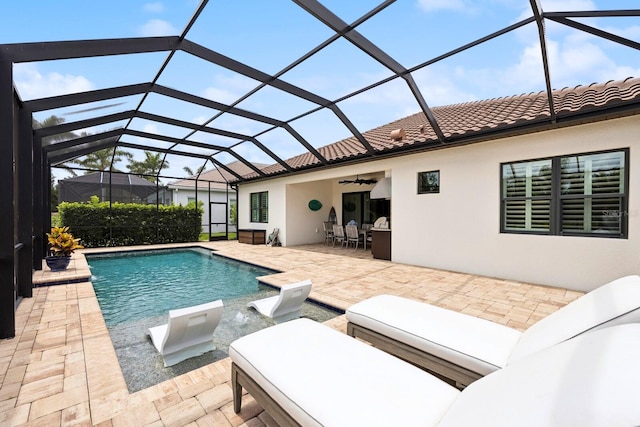 13606 Deep Blue Pl, Bradenton, FL 34211 - outdoor pool featuring a ceiling fan, a patio area, and glass enclosure