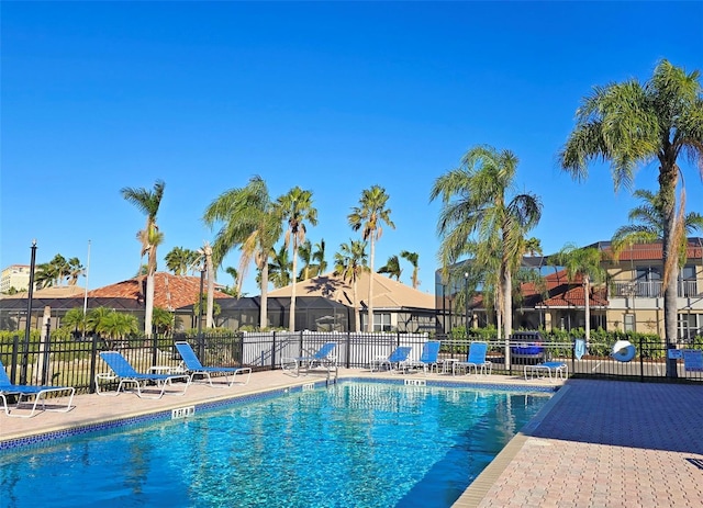 303 9th Ave E, Palmetto, FL 34221 - community pool with a patio area and a residential view