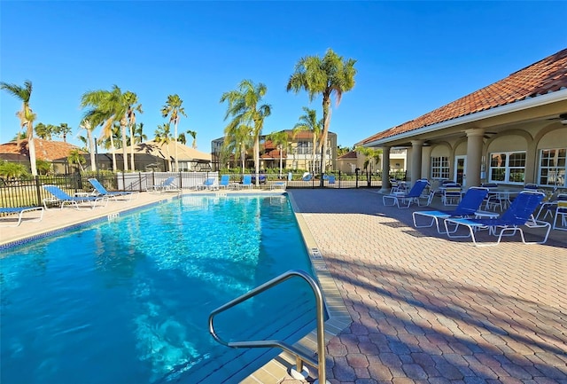 303 9th Ave E, Palmetto, FL 34221 - community pool with a patio area and ceiling fan