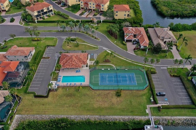 303 9th Ave E, Palmetto, FL 34221 - aerial view of property's location with a large body of water, a pool, and nearby suburban area