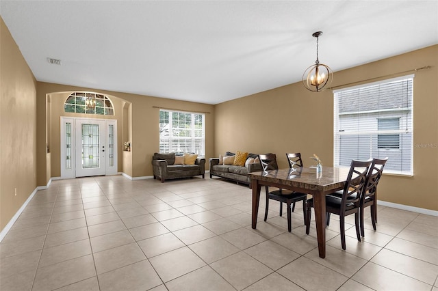 5981 Willows Bridge Loop, Ellenton, FL 34222 - dining area featuring light tile patterned floors, a chandelier, and baseboards
