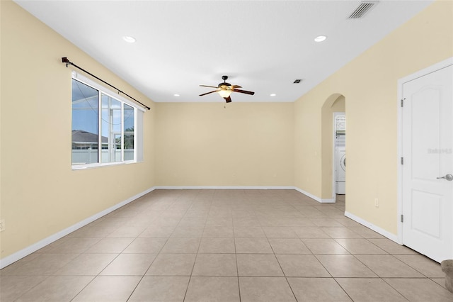5981 Willows Bridge Loop, Ellenton, FL 34222 - empty room with arched walkways, ceiling fan, washer / dryer, light tile patterned flooring, and recessed lighting