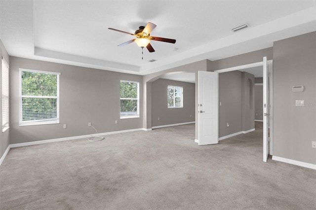 5981 Willows Bridge Loop, Ellenton, FL 34222 - spare room with ceiling fan, a raised ceiling, arched walkways, and baseboards