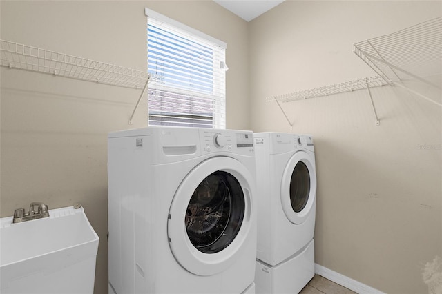 5981 Willows Bridge Loop, Ellenton, FL 34222 - laundry area with washer and dryer and light tile patterned floors