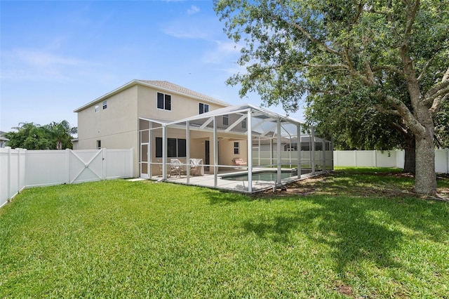 5981 Willows Bridge Loop, Ellenton, FL 34222 - rear view of house featuring stucco siding, a patio area, and glass enclosure