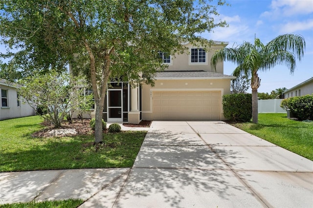 5981 Willows Bridge Loop, Ellenton, FL 34222 - view of front of house with stucco siding, concrete driveway, and an attached garage