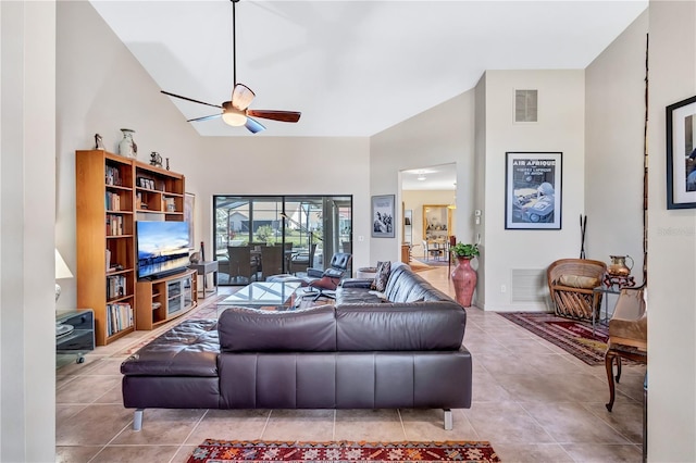 105 Inlets Blvd Unit 105, Nokomis, FL 34275 - living room with a ceiling fan, high vaulted ceiling, and tile patterned flooring