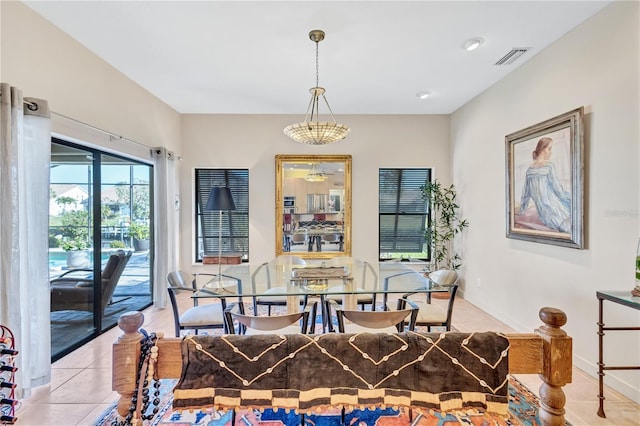 105 Inlets Blvd Unit 105, Nokomis, FL 34275 - dining space featuring light tile patterned flooring and baseboards