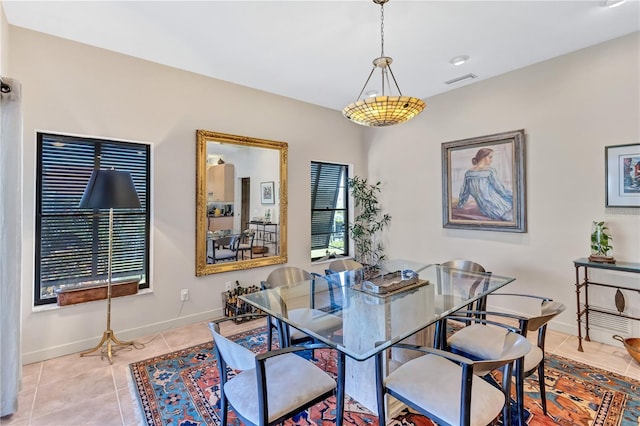 105 Inlets Blvd Unit 105, Nokomis, FL 34275 - dining area featuring light tile patterned floors and baseboards