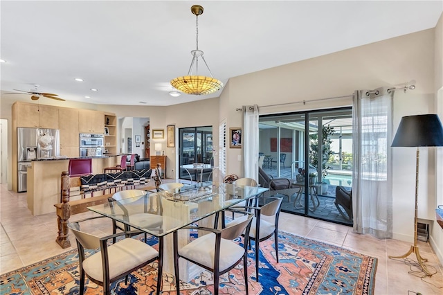 105 Inlets Blvd Unit 105, Nokomis, FL 34275 - dining room with light tile patterned flooring, a ceiling fan, recessed lighting, and baseboards