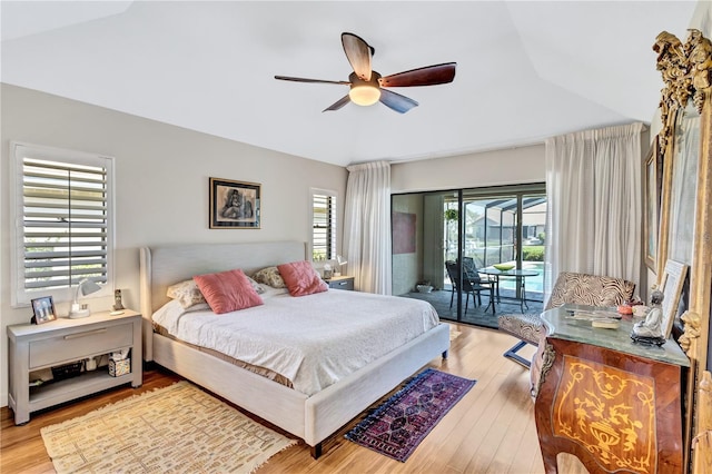 105 Inlets Blvd Unit 105, Nokomis, FL 34275 - bedroom featuring access to outside, lofted ceiling, wood finished floors, and ceiling fan