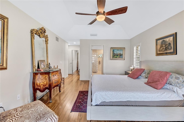 105 Inlets Blvd Unit 105, Nokomis, FL 34275 - bedroom with light wood-type flooring, lofted ceiling, ceiling fan, and ensuite bathroom