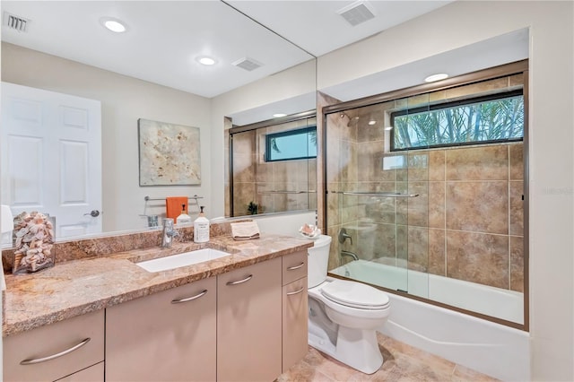 105 Inlets Blvd Unit 105, Nokomis, FL 34275 - bathroom with vanity, toilet, enclosed tub / shower combo, and recessed lighting