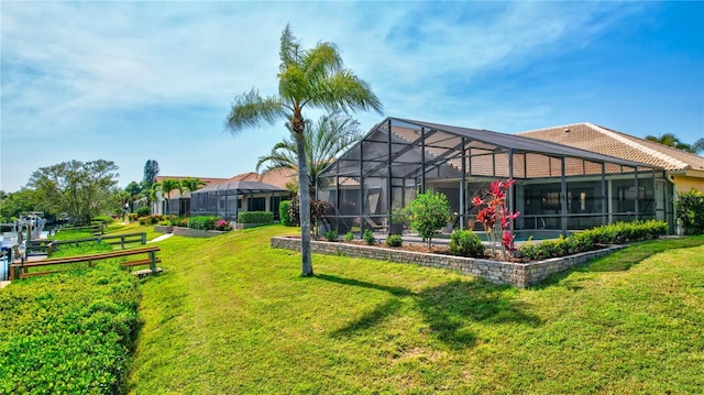 105 Inlets Blvd Unit 105, Nokomis, FL 34275 - back of house with a yard and glass enclosure