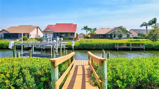 105 Inlets Blvd Unit 105, Nokomis, FL 34275 - dock area with boat lift, a residential view, and a water view