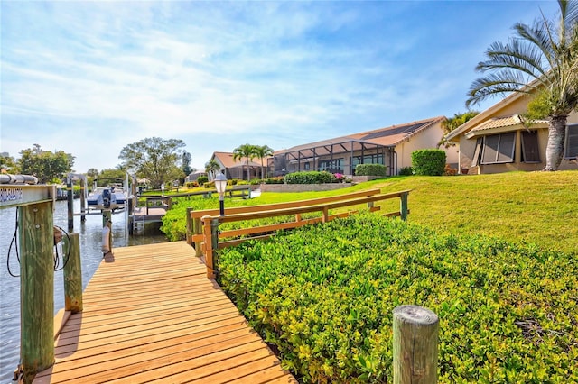 105 Inlets Blvd Unit 105, Nokomis, FL 34275 - dock with a lawn, a water view, and boat lift