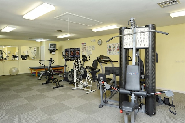 105 Inlets Blvd Unit 105, Nokomis, FL 34275 - workout area with attic access, carpet, and baseboards