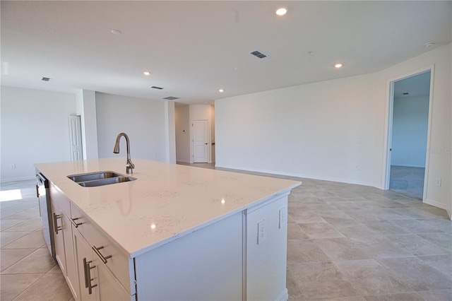 17715 Boracay Ct Unit 202, Venice, FL 34293 - kitchen featuring a sink, a center island with sink, light stone counters, open floor plan, and recessed lighting