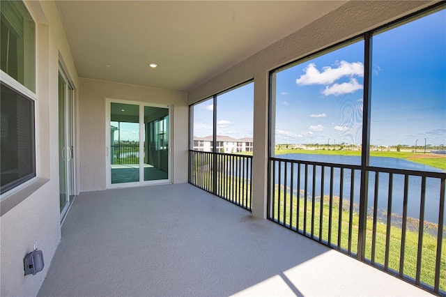 17715 Boracay Ct Unit 202, Venice, FL 34293 - unfurnished sunroom featuring a water view and recessed lighting