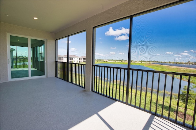 17715 Boracay Ct Unit 202, Venice, FL 34293 - unfurnished sunroom with a water view and recessed lighting