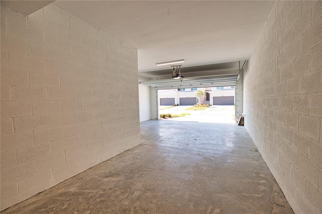 17715 Boracay Ct Unit 202, Venice, FL 34293 - garage featuring concrete block wall and a garage door opener