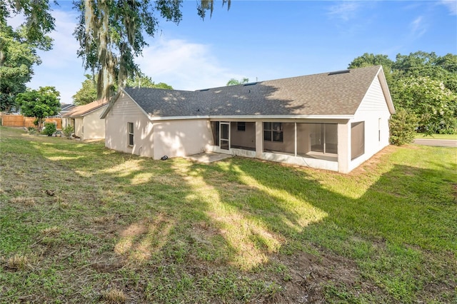 294 Lake Doe Blvd, Apopka, FL 32703 - rear view of house with a sunroom, roof with shingles, a yard, and stucco siding