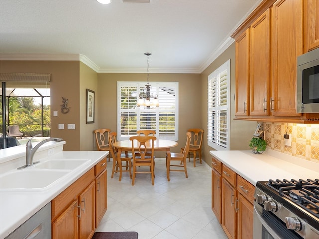 8078 Stirling Falls Cir, Sarasota, FL 34243 - kitchen with a sink, stainless steel microwave, dishwashing machine, light countertops, and a chandelier