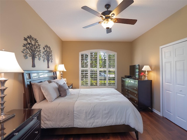 8078 Stirling Falls Cir, Sarasota, FL 34243 - bedroom with dark wood-style floors, a ceiling fan, baseboards, and a closet