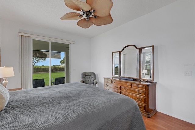 9402 71st Ave E, Palmetto, FL 34221 - bedroom with access to exterior, light wood finished floors, multiple windows, and baseboards