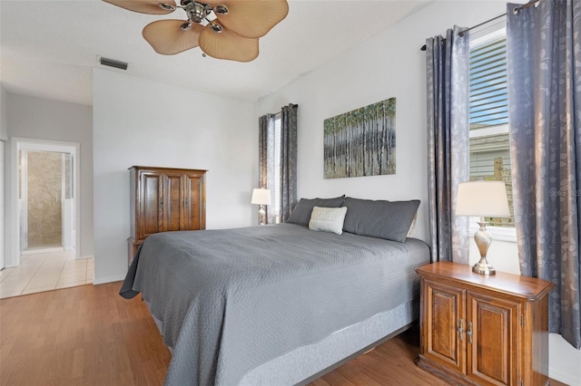 9402 71st Ave E, Palmetto, FL 34221 - bedroom featuring light wood finished floors and a ceiling fan