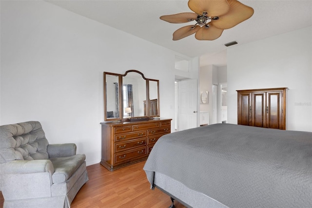 9402 71st Ave E, Palmetto, FL 34221 - bedroom featuring light wood-style flooring, ensuite bathroom, and a ceiling fan