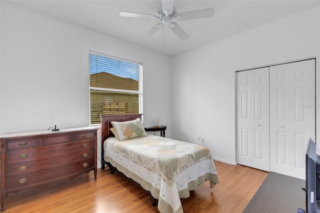 9402 71st Ave E, Palmetto, FL 34221 - bedroom with light wood-style floors, a closet, and ceiling fan