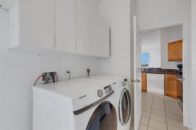 9402 71st Ave E, Palmetto, FL 34221 - laundry room featuring cabinet space, washing machine and clothes dryer, and light tile patterned floors