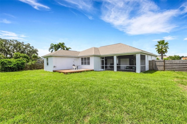 9402 71st Ave E, Palmetto, FL 34221 - rear view of house with a wooden deck, stucco siding, and a sunroom