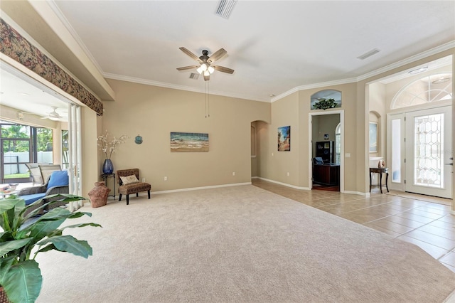 5359 90th Avenue Cir E, Parrish, FL 34219 - living area with ceiling fan, arched walkways, crown molding, light tile patterned flooring, and baseboards