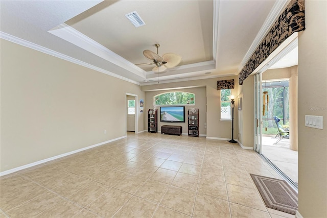 5359 90th Avenue Cir E, Parrish, FL 34219 - unfurnished living room with a raised ceiling, plenty of natural light, light tile patterned floors, ceiling fan, and ornamental molding
