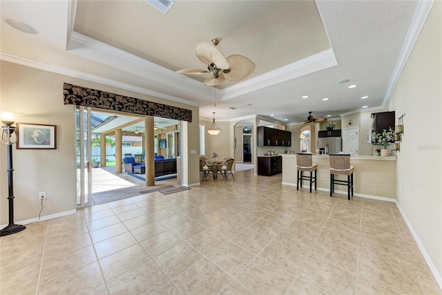 5359 90th Avenue Cir E, Parrish, FL 34219 - living area featuring a ceiling fan, a raised ceiling, crown molding, light tile patterned floors, and recessed lighting